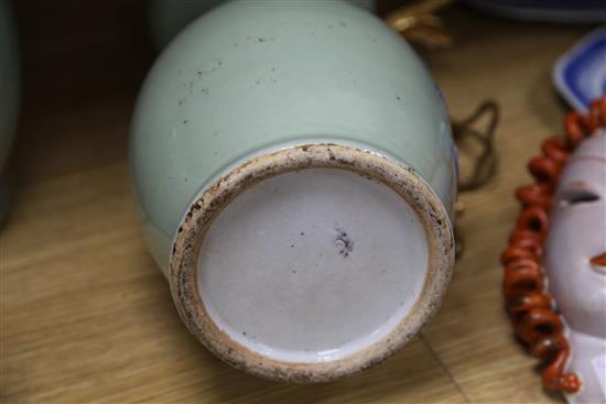 A pair of Chinese underglaze blue and white slip celadon glazed vases, H.35cm